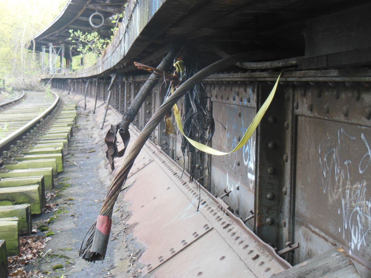 architecture, built structure, rail transportation, railroad track, track, no people, day, transportation, the way forward, direction, building exterior, obsolete, outdoors, metal, building, abandoned, nature, staircase, public transportation, messy