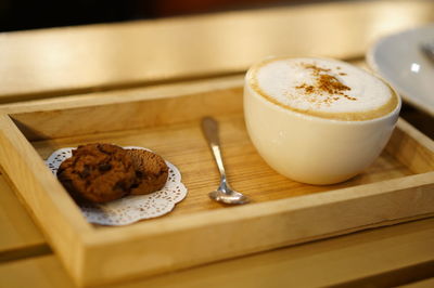 High angle view of coffee and bread on table