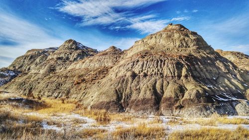 Low angle view of rock formations against sky