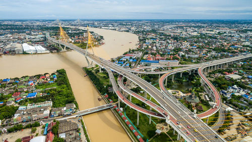 High angle view of bridge and cityscape against sky