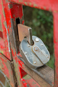 Close-up of padlock on rusty metal