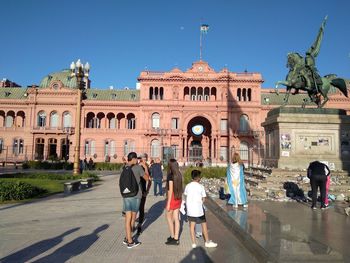 Group of people in front of historical building