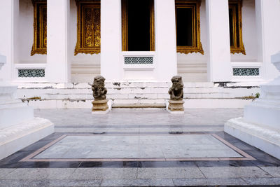 Statue against historic building