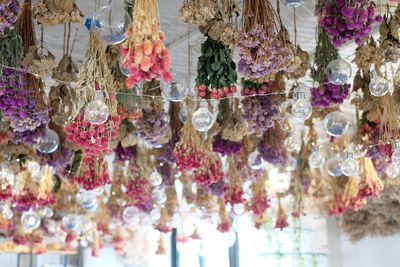 Close-up of decorations hanging in shop