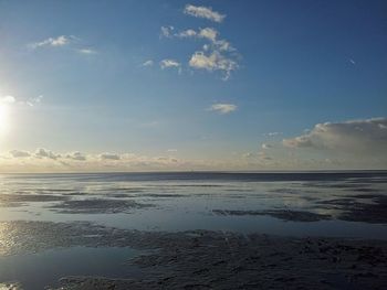 Scenic view of sea against sky at sunset