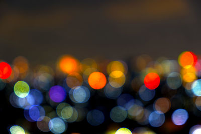 Defocused image of illuminated lights at night