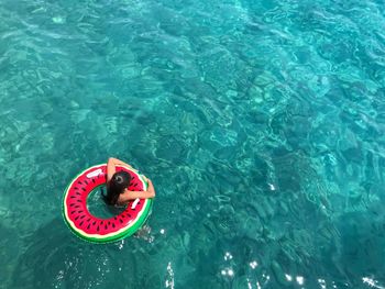 High angle view of boy swimming in pool