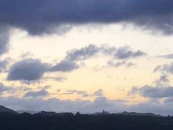 Low angle view of silhouette mountain against sky