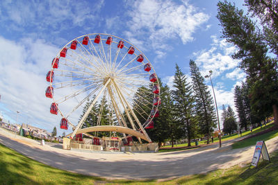 Ferris wheel against sky in city