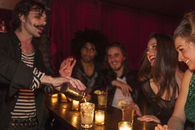 Bartender serving drinks at a nightclub