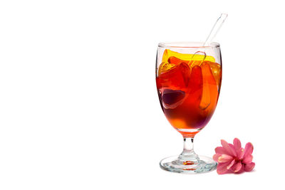 Close-up of wine glass against white background