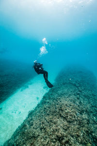 High angle view of man swimming in sea