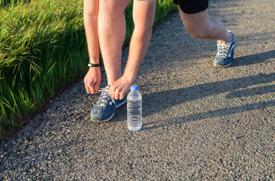 Low section of man running on floor