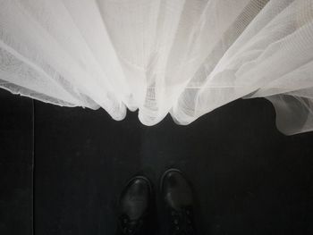 Close up of person standing on tiled floor