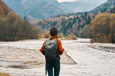 Rear view of man looking at mountains