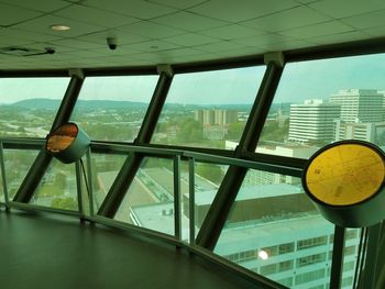 Low angle view of buildings seen through glass window