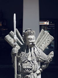 Close-up of buddha statue at night