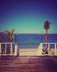 Scenic view of sea against clear blue sky