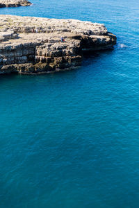 Scenic view of sea against blue sky