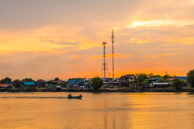 Scenic view of river against sky during sunset