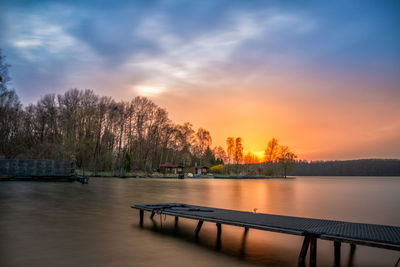 Scenic view of lake against sky during sunset