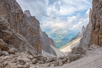 Rocky mountain canyon with a scenic view to a valley in the alps