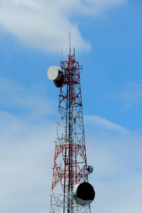 Low angle view of communications tower against sky