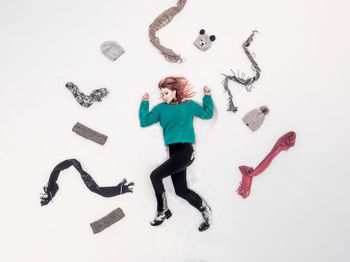 High angle view of young woman against white background