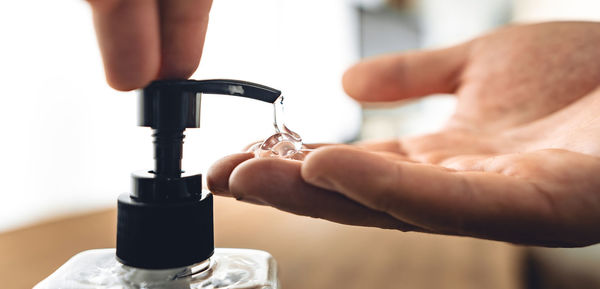 Close-up of hand holding machine