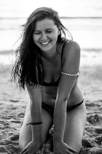 Smiling young woman at beach