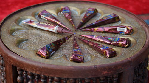 High angle view of metallic container on table