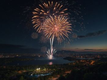 Low angle view of firework display at night