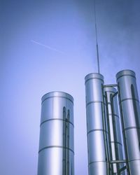 Low angle view of smoke stack against sky