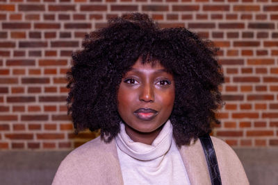 Portrait of young woman with curly hair