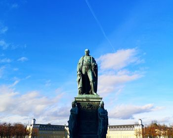 Low angle view of statue against sky