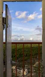 Close-up of wooden fence against sky