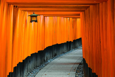 Vermillion gates at the fushimi inari shrine, kyoto, japan