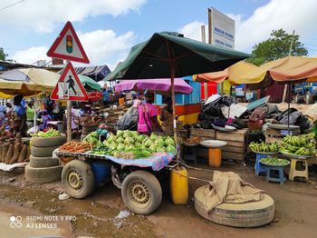 Group of people for sale at market stall