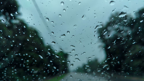 Full frame shot of raindrops on glass window