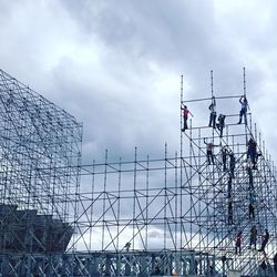 People on scaffolding at construction site