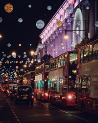 Illuminated city street at night