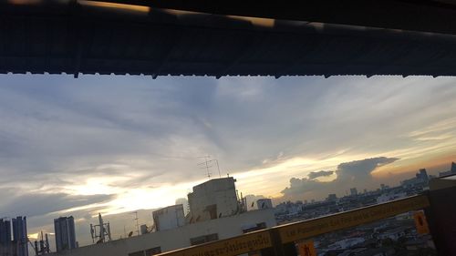 Low angle view of buildings against sky during sunset