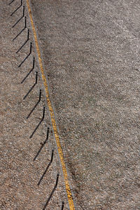 High angle view of tire tracks on road