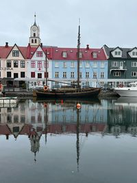 Sailingboat in the historic harbour of torshavn, faroe islands