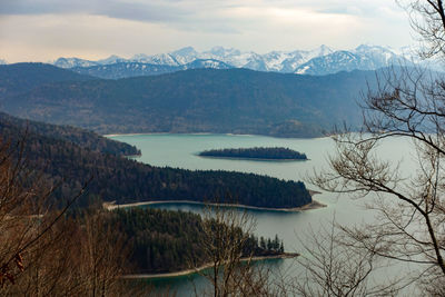 Scenic view of lake and mountains against sky