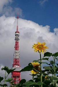 Low angle view of tower against cloudy sky