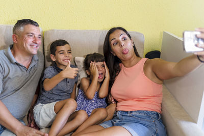 Family with children having fun at home