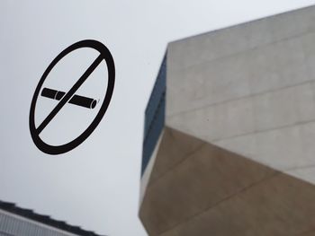 Low angle view of sign on wall