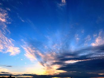 Low angle view of dramatic sky during sunset