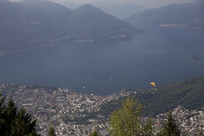 High angle view of city and mountains against sky